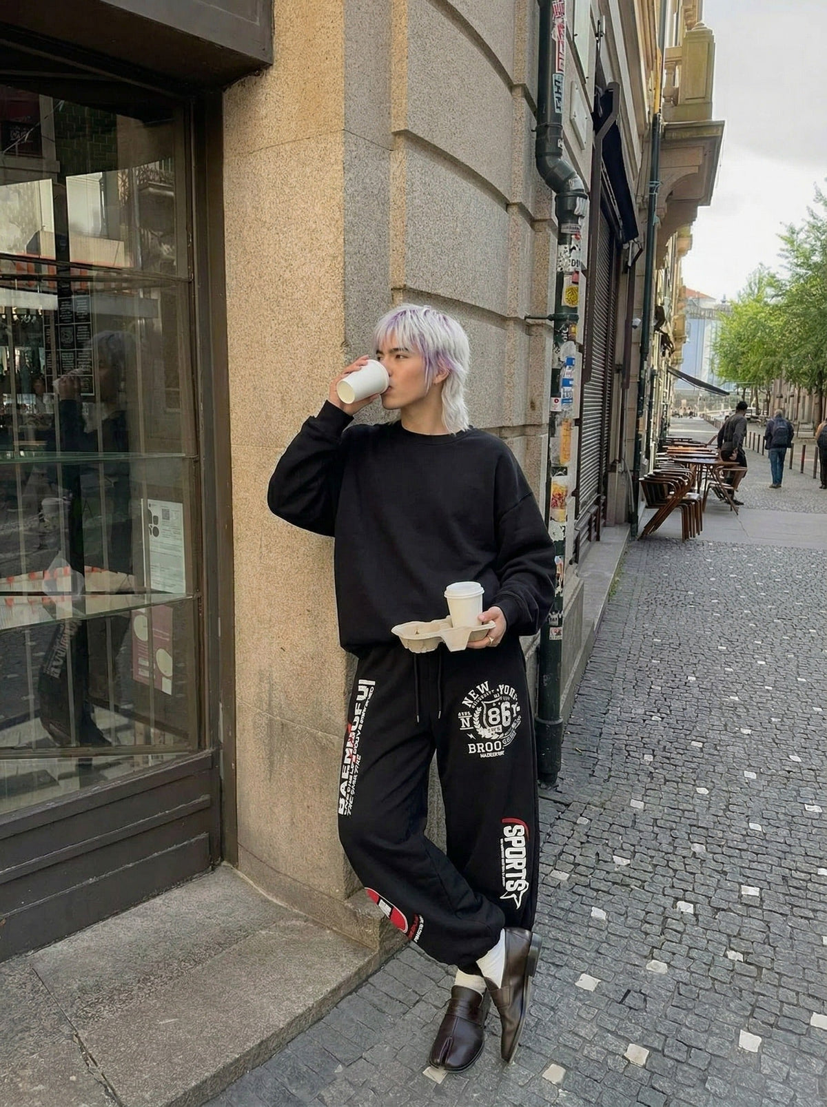 DAXUEN Graphic print wide leg sweatpants in black and white — model photo