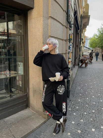 DAXUEN Graphic print wide leg sweatpants in black and white — model photo