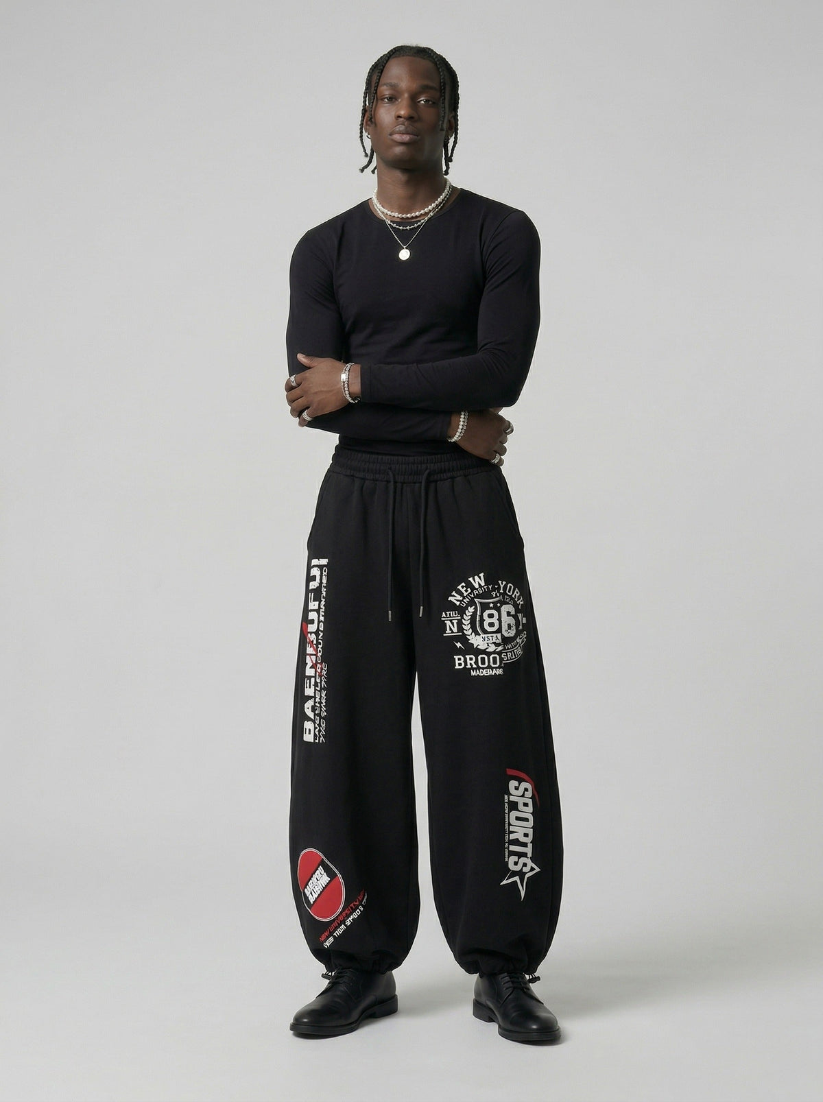 DAXUEN Graphic print wide leg sweatpants in black and white — model photo