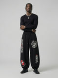 DAXUEN Graphic print wide leg sweatpants in black and white — model photo