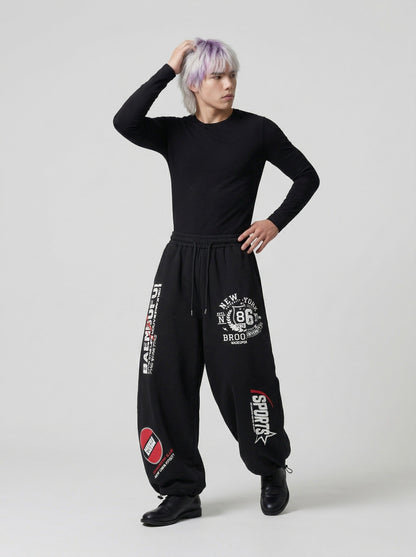 DAXUEN Graphic print wide leg sweatpants in black and white — model photo