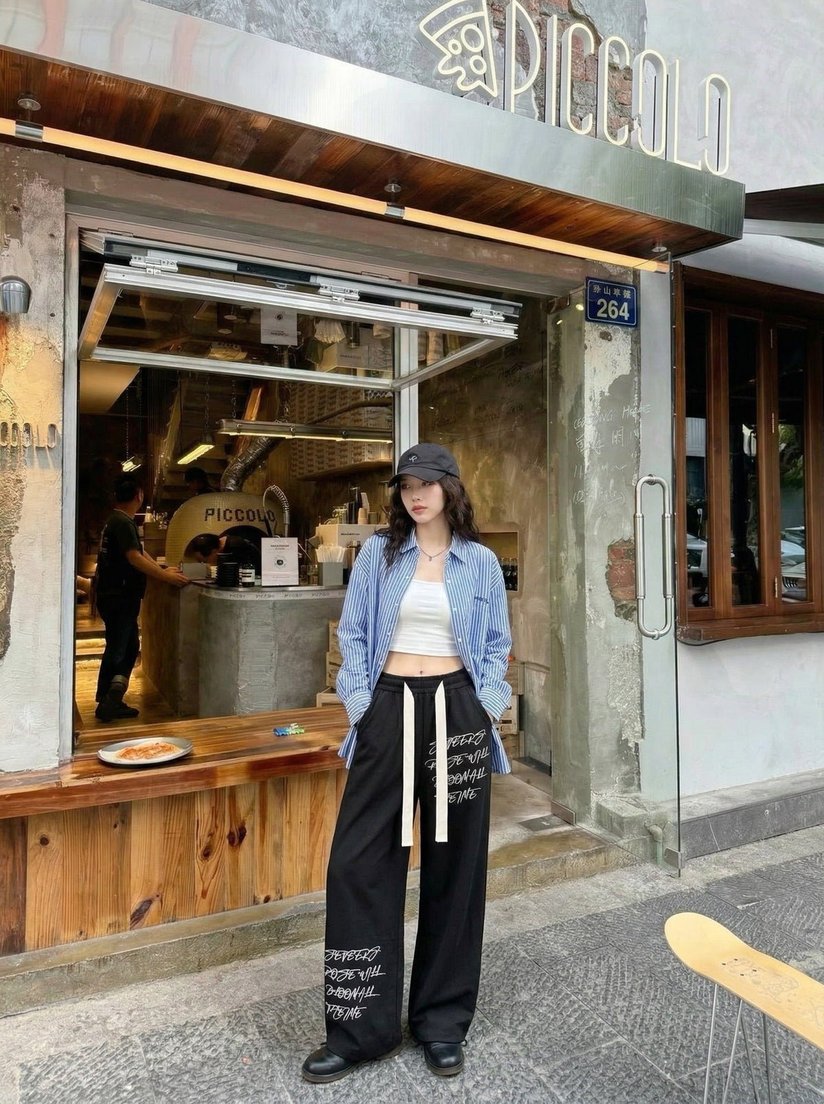 DAXUEN Graphic wide-leg trousers in black and mocha — model photo