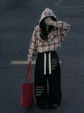 DAXUEN Graphic wide-leg trousers in black and mocha — model photo