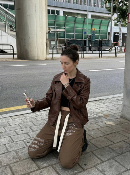 DAXUEN Graphic wide-leg trousers in black and mocha — model photo