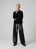 DAXUEN Graphic wide-leg trousers in black and mocha — model photo
