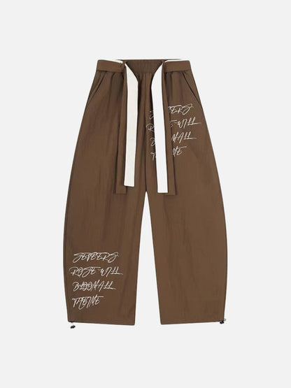 DAXUEN Graphic wide-leg trousers in black and mocha