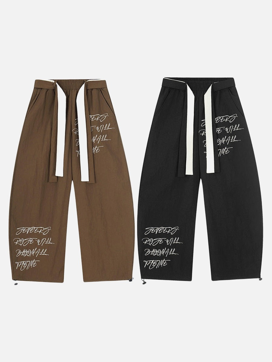 DAXUEN Graphic wide-leg trousers in black and mocha
