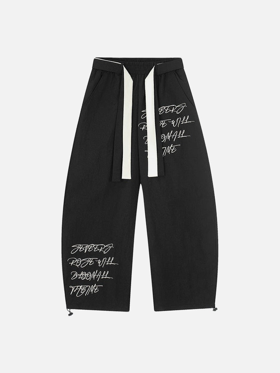 DAXUEN Graphic wide-leg trousers in black and mocha
