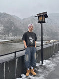 DAXUEN washed black oversized grayscale portrait graphic t-shirt — model photo