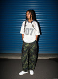 DAXUEN green and black camouflage wide-leg cargo pants — model photo