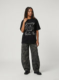 DAXUEN Black short-sleeved t-shirt with graphic text — model photo