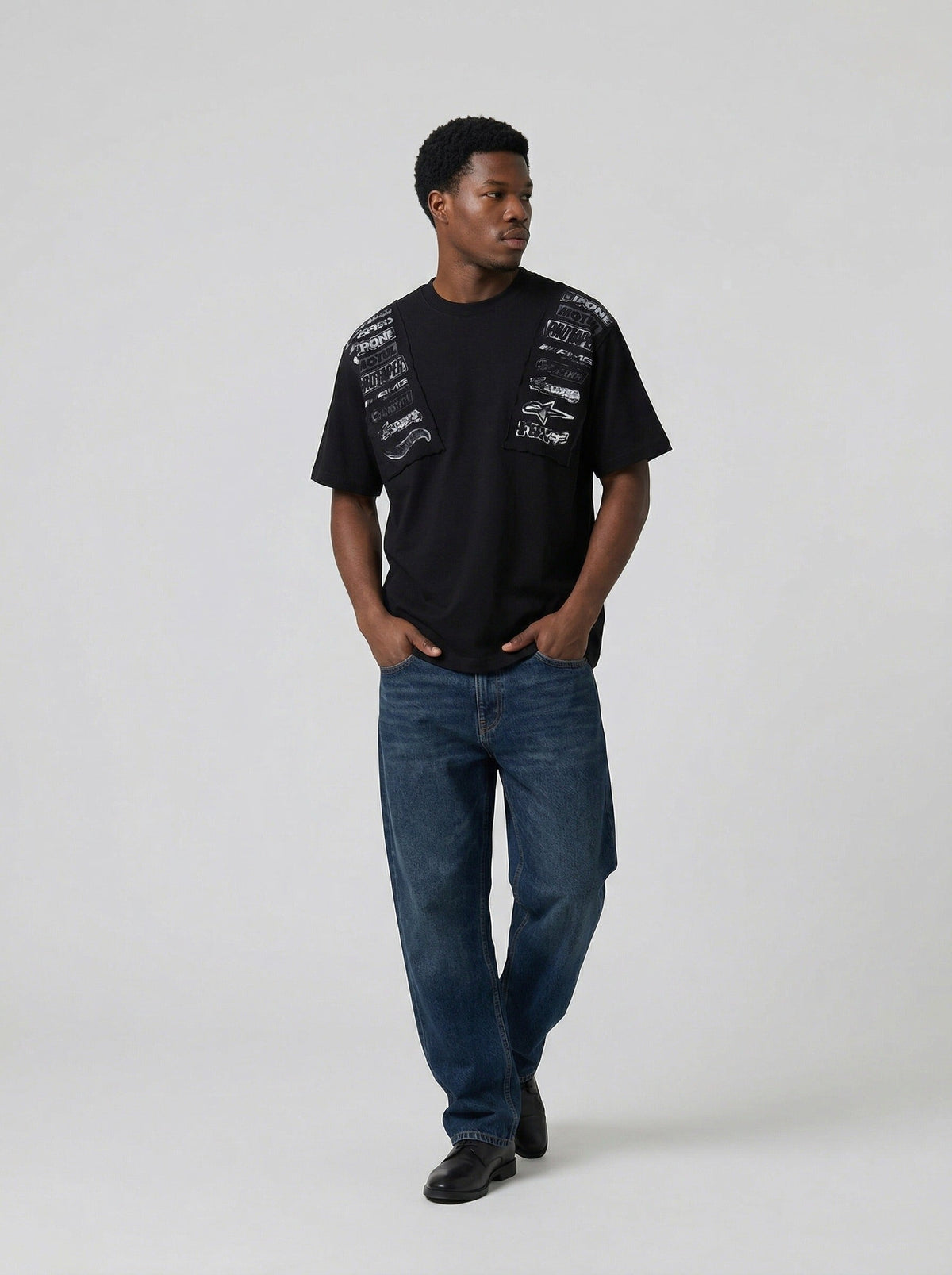DAXUEN Short-sleeved crew neck T-shirt with grunge graphics — model photo