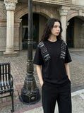 DAXUEN Short-sleeved crew neck T-shirt with grunge graphics — model photo