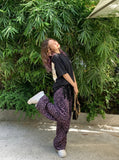 DAXUEN Oversized short-sleeved t-shirt with grunge print — model photo