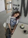 DAXUEN Graphic t-shirt featuring biker illustration and distressed text — model photo