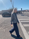 DAXUEN heather grey cardigan with black fuzzy trim — model photo