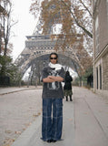 DAXUEN Oversized t-shirt with graphic print and acid-wash finish — model photo