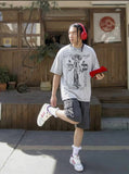 DAXUEN Oversized t-shirt with graphic print and acid-wash finish — model photo