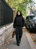 DAXUEN black oversized high-collar bomber jacket — model photo