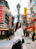 DAXUEN Short-sleeved embroidered t-shirt with horse graphic — model photo