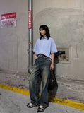 DAXUEN Oversized short-sleeved button-down shirt with stripes — model photo