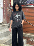 DAXUEN washed-out black oversized humanoid motion graphic tee — model photo