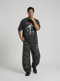 DAXUEN washed-out black oversized humanoid motion graphic tee — model photo