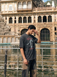 DAXUEN washed-out black oversized humanoid motion graphic tee — model photo