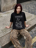 DAXUEN Short-sleeved graphic t-shirt with dog-themed prints — model photo