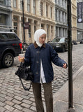 DAXUEN indigo blue denim jacket with brown collar and toggle clasps — model photo