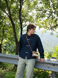 DAXUEN indigo blue denim jacket with brown collar and toggle clasps — model photo