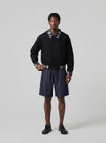 DAXUEN Men's relaxed-fit denim shorts in dark indigo blue — model photo
