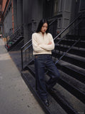 DAXUEN Indigo wide-leg jeans with golden-yellow stitching — model photo