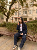 DAXUEN Indigo wide-leg jeans with golden-yellow stitching — model photo