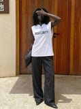 DAXUEN Short-sleeved graphic T-shirt with text prints — model photo