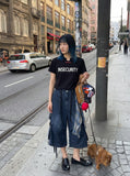 DAXUEN Short-sleeved graphic T-shirt with text prints — model photo