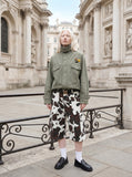 DAXUEN olive green utility jacket with intricate badge — model photo