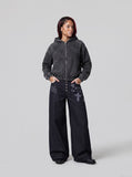 DAXUEN dark indigo wide-leg gothic graphic denim pants — model photo