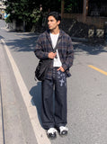 DAXUEN dark indigo wide-leg gothic graphic denim pants — model photo