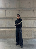 DAXUEN dark indigo wide-leg gothic graphic denim pants — model photo
