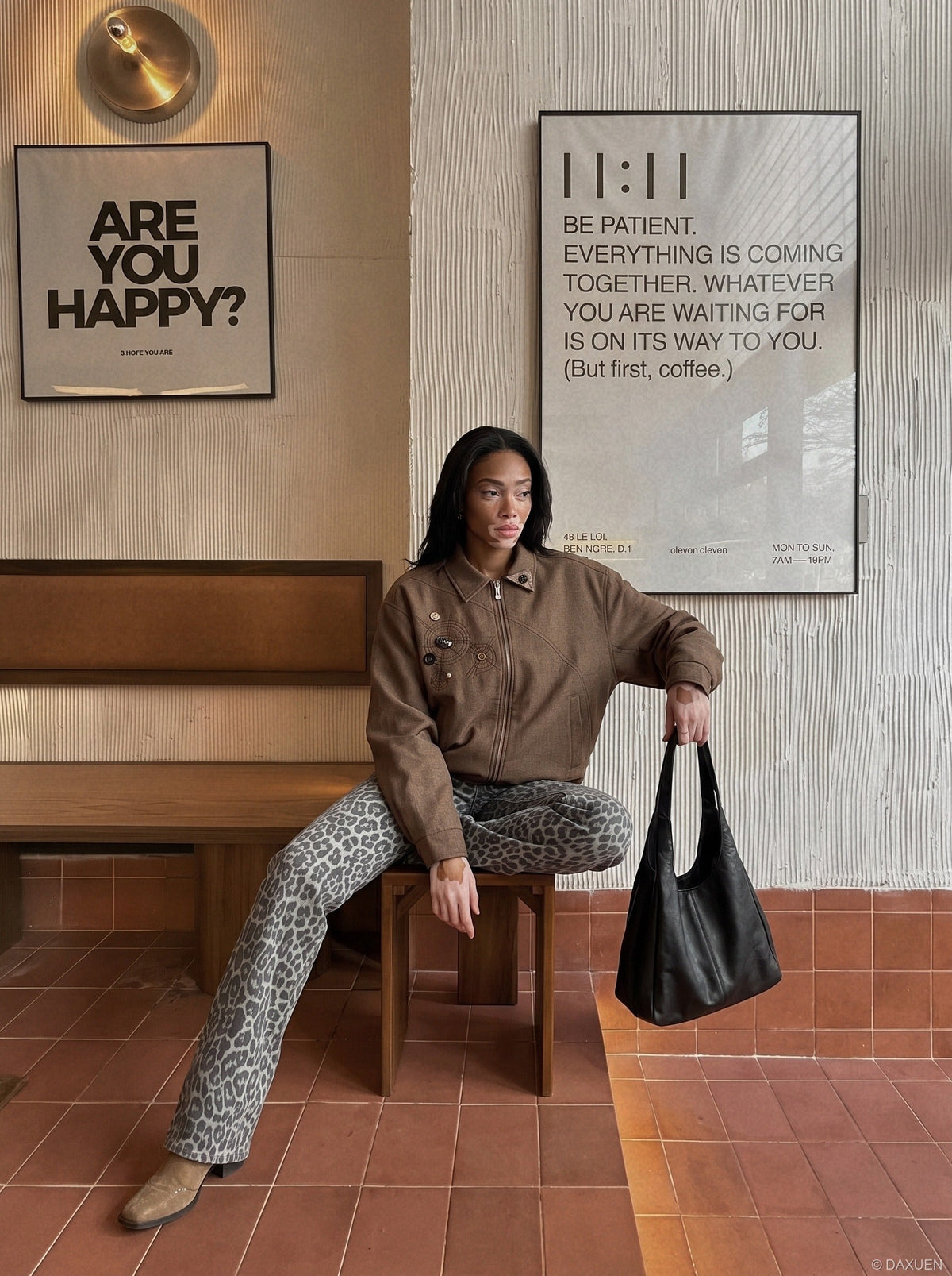 DAXUEN brown oversized jacket with intricate orbital design — model photo