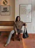 DAXUEN brown oversized jacket with intricate orbital design — model photo