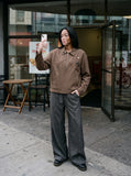 DAXUEN brown oversized jacket with intricate orbital design — model photo