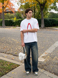 DAXUEN black oversized inverted U-graphic T-shirt — model photo