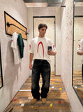 DAXUEN black oversized inverted U-graphic T-shirt — model photo