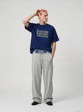DAXUEN navy blue oversized italicized-serif graphic t-shirt — model photo