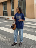 DAXUEN navy blue oversized italicized-serif graphic t-shirt — model photo