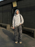 DAXUEN Wide-leg jeans with cut-out panels and stone-washed finish — model photo