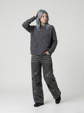DAXUEN Wide-leg jeans with cut-out panels and stone-washed finish — model photo
