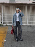 DAXUEN Wide-leg jeans with cut-out panels and stone-washed finish — model photo